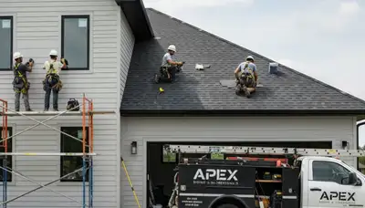 Vinyl siding contractors repairing storm-damaged roof in Austin, TX home exterior